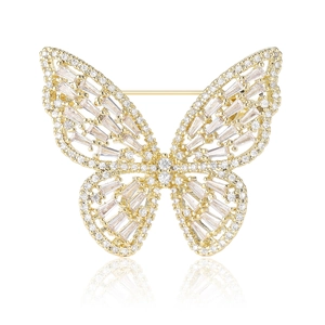 Elegant gold butterfly brooch with micro-pave crystals on a white background