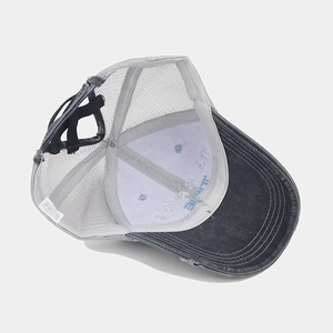 Distressed vintage trucker hat with breathable mesh and embroidery detail on front