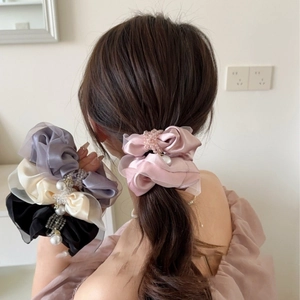 Elegant satin scrunchies with faux pearls and crystals set in soft pastel colors