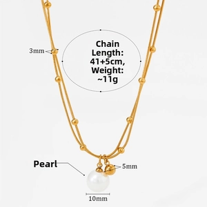 Detail of 18K gold double layer beaded necklace featuring a 10mm pearl and small gold bead
