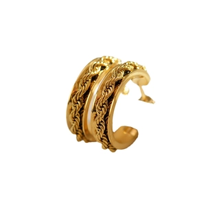 Multi-layer C-shaped gold hoop earrings with twisted rope texture and polished metal finish