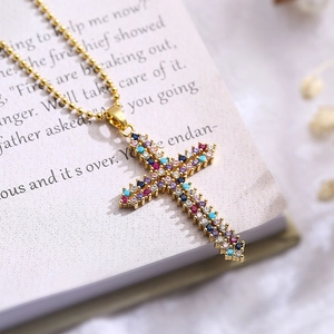 Golden cross pendant necklace with colorful zircons on a beaded chain for women