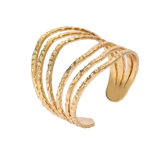 Macro shot of 18k gold plated multi-layer open ring with hammered metal texture