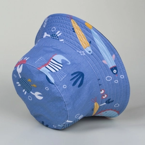 Detail of blue sun hat with cartoon ocean fish pattern and durable fabric texture
