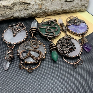 Vintage bronze necklaces with snake dragon and skull designs with crystal pendants