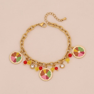Detailed view of golden fruit charm necklace with colorful beads and crystal accents