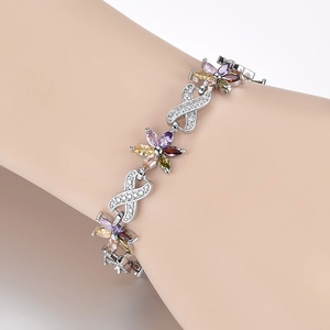 Macro shot of silver flower bracelet featuring multicolored marquise zircon stones and crystals