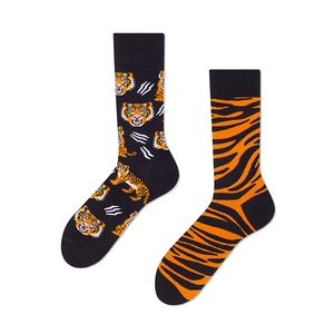 Detail view of black crew socks featuring tiger face prints and orange tiger stripes