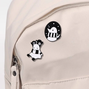 Minimalist black and white alien enamel pins on canvas backpack for bag decoration