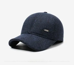 Detail of navy blue wool-blend baseball cap with side metal SPORT emblem decoration