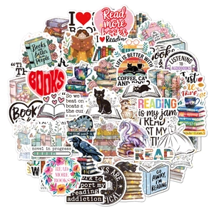 Close-up of holographic vinyl stickers featuring fantasy books, cats, and reading quotes
