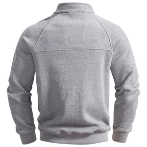 Detail of gray men's sweatshirt showing vertical knit texture and ribbed hem on back