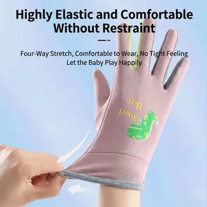 Pink winter kids ski gloves featuring a green dinosaur and flexible four-way stretch fabric