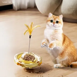 Interactive tumbler cat toy with feather wand and treat dispenser in home setting