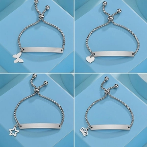 Detailed view of four adjustable stainless steel bracelets with blank plates and charms