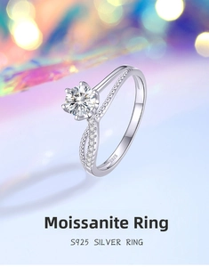 Macro detail of S925 silver six-prong moissanite ring with twisted pavé band design