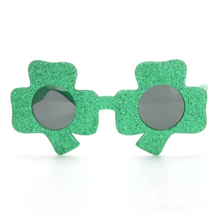 Macro detail of St. Patrick's Day clover glasses with sparkling green glitter coating