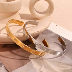 Adjustable 18K gold and silver plated bangles with starburst engraving and crystals