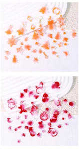 Flat lay of resin Christmas earrings featuring trees, snowflakes, and gingerbread man
