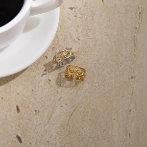 Classic 18K gold plated stainless steel star and moon cutout open rings on stone texture