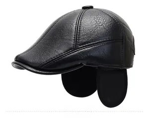Detail view of black faux leather winter cap with ear flaps and lychee texture