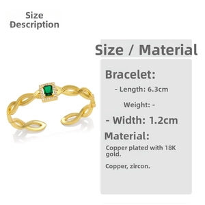 Detail of 18K gold-plated open bangle with green zircon and pavé crystal accents
