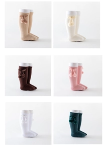 Detailed grid view of ribbed baby knee-high socks with cute bows and pom-poms in six colors