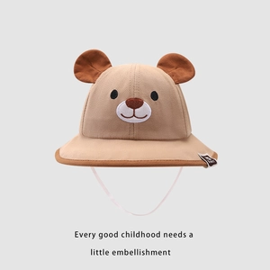 Close-up of khaki cotton sun hat for kids featuring cute bear ears and embroidery