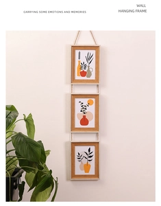Hanging vertical triple photo frames with natural hemp rope and abstract plant art prints