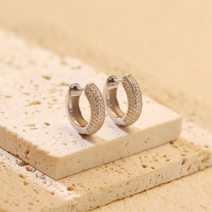 Macro shot of S925 sterling silver stamp and sparkling cubic zirconia pavé setting