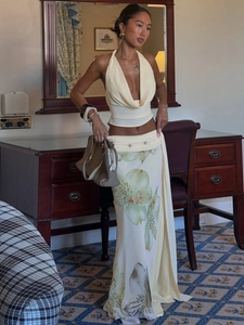 Chic cream halter neck top and floral print maxi skirt set with mesh slit detail