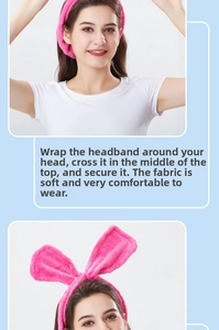 Detailed view of pink coral fleece headband with rabbit ears and soft velvet texture