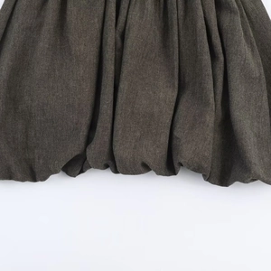 Deep grey mini balloon dress in cotton linen with minimalist textured pleated hem detail