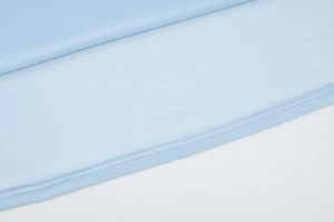 Detail of light blue mesh fabric showing high-quality stitching and breathable texture