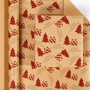 Detail showing rolled Christmas kraft paper with red tree patterns and gift box wrapping
