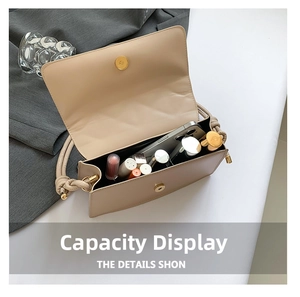 Close-up of beige crossbody bag interior showing phone and cosmetics storage capacity