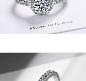 Macro view of S925 sterling silver ring showing full hallmark and sparkling zircon stones