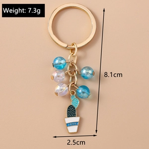 Detail of beaded cactus keychain with LOVE engraving, showing size 8.1cm and 7.3g weight