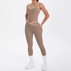 Detail of coffee yoga set showing high waist cross design and white contrast piping