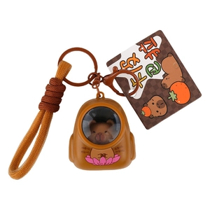 Cute Capybara astronaut keychain with woven lanyard and lotus themed good luck charm
