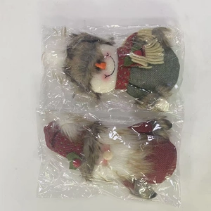 Christmas plush gnome and snowman dolls set in protective packaging for festive decoration