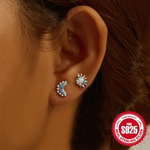 Asymmetric S925 sterling silver stud earrings with moon and sun design and blue zircon stones