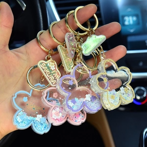 Cartoon cherry blossom acrylic liquid keychain with floating glitter and star sequins