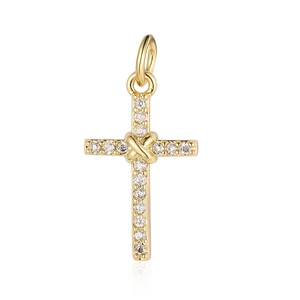 Macro shot of gold cross charm pendant with sparkling cubic zirconia inlay and top ring loop
