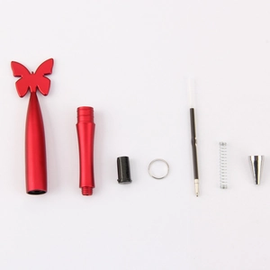Detailed view of disassembled red butterfly pen parts including ink refill and spring