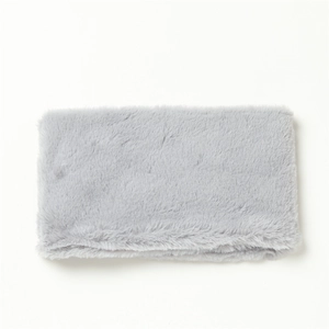 Close-up of soft grey faux rabbit fur neck warmer with plush texture on white background