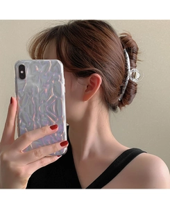 Clear resin hair claw clip shown on hair in a stylish updo hairstyle for women