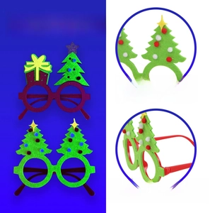 Fluorescent felt Christmas glasses with tree and star detail under UV light effect