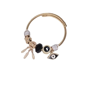 Gold cable charm bracelet with dreamcatcher, evil eye, and black gemstone charms
