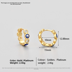 Detailed view of 15mm gold evil eye hoop earrings with blue enamel and zircon stones